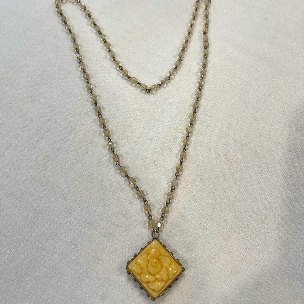 Vintage necklace beige/natural bonelike pendant with glass beads throughout 24”